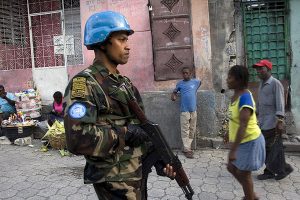 A Sri Lankan peacekeeper from United Nations Stabilization Mission in Haiti (MINUSTAH) patrols the slum of Martissant in the southern hills of Haiti capital Port-au-Prince, where violence is rampant and security measures have been increased since a prison break of about 4,000 convicts.